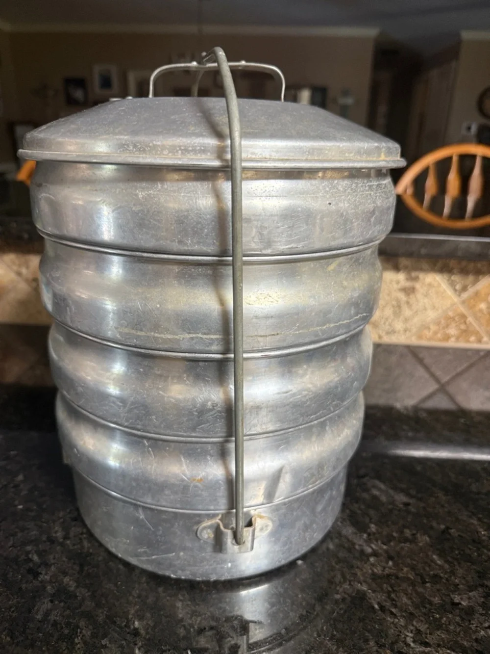 This vintage item is a Regal Aluminum Picnic Carrier.